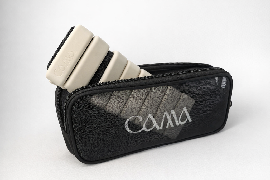 Beige ankle and wrist weights stored in black travel case from CAMA Reform