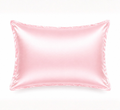 Pink mulberry silk pillowcase styled for beauty sleep ritual