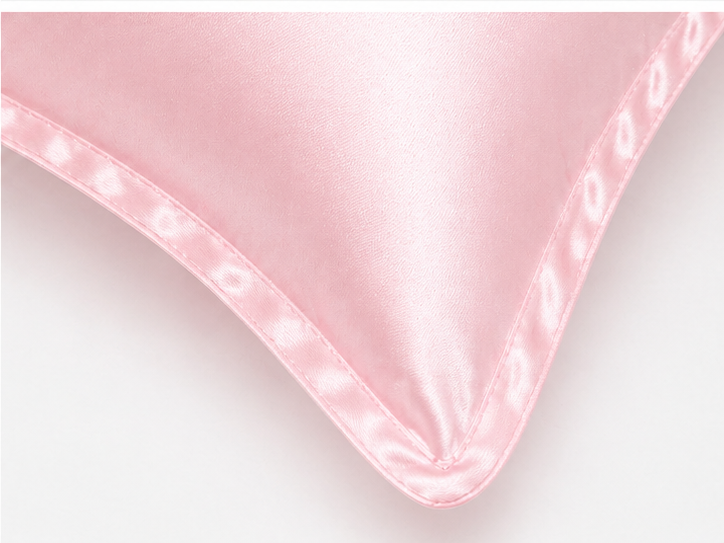 Pink mulberry silk pillowcase styled for beauty sleep ritual