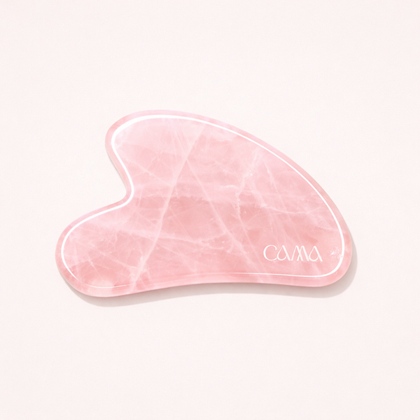Rose quartz gua sha massage tool from CAMA Reform for facial rituals