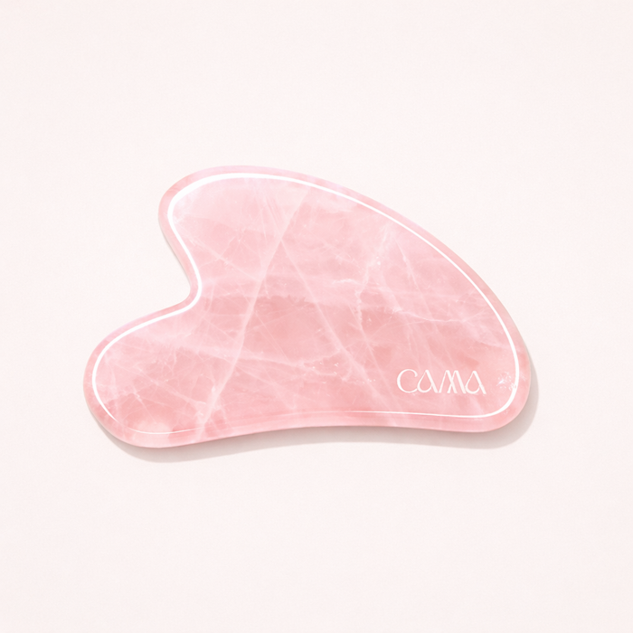 Rose quartz gua sha massage tool from CAMA Reform for facial rituals