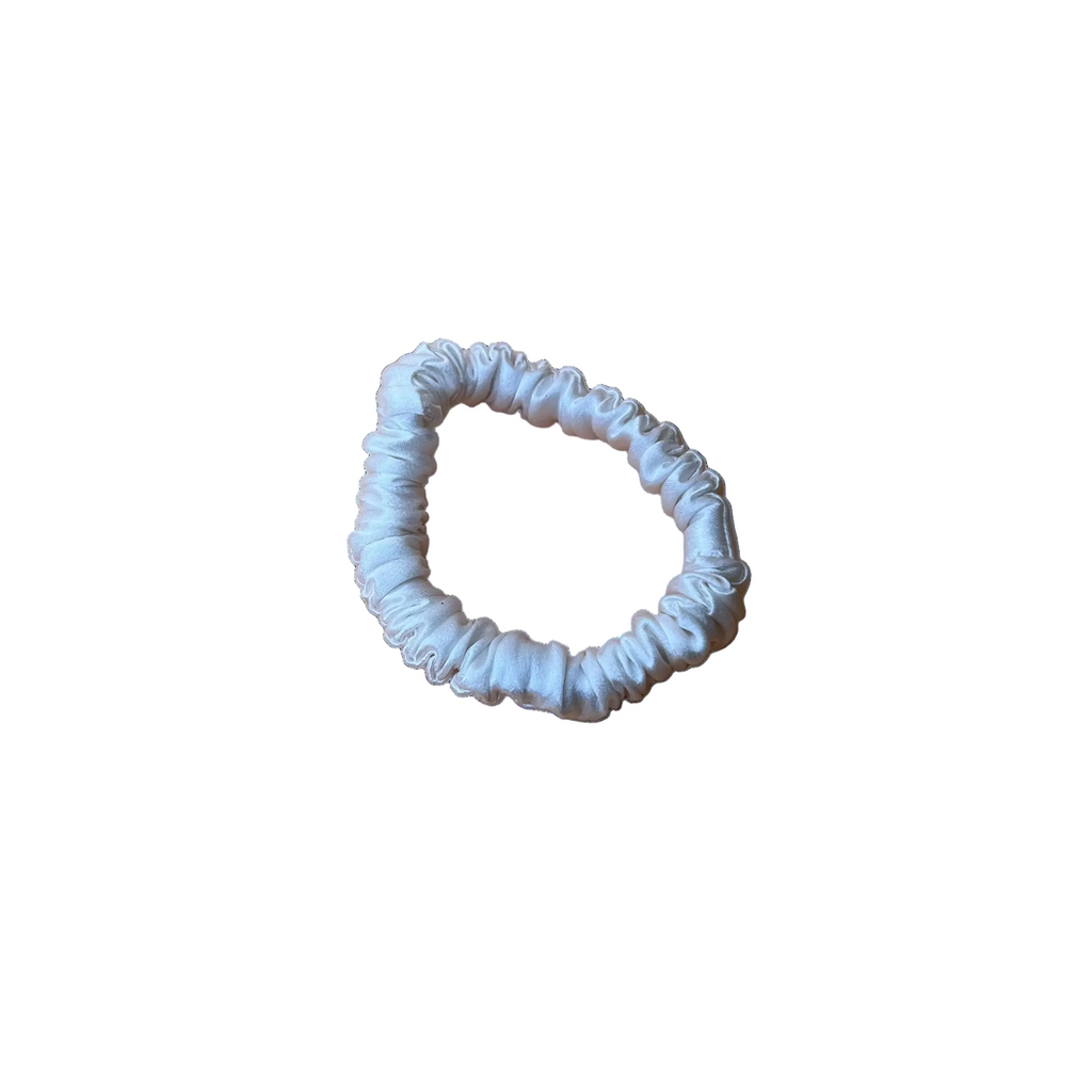 Ivory mulberry silk scrunchie designed to reduce hair friction